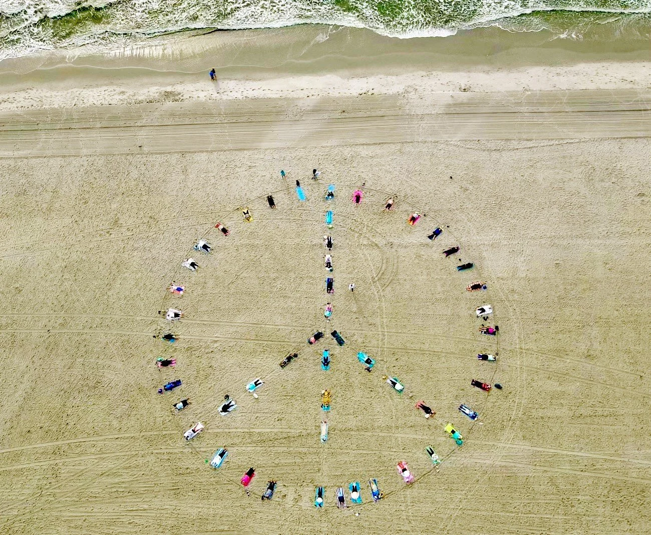 NJ Beach Yoga's “Pose for Peace” on Labor Day raised over $1200